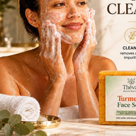 Woman cleansing her face with Thévaa Turmeric Face Soap