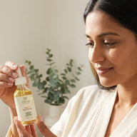 Woman holding Thévaa Turmeric Face Serum